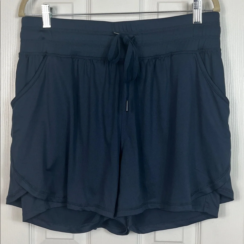 Livi navy blue athletic shorts with rash shirt under. Size 14/16. Pockets - Picture 2 of 7